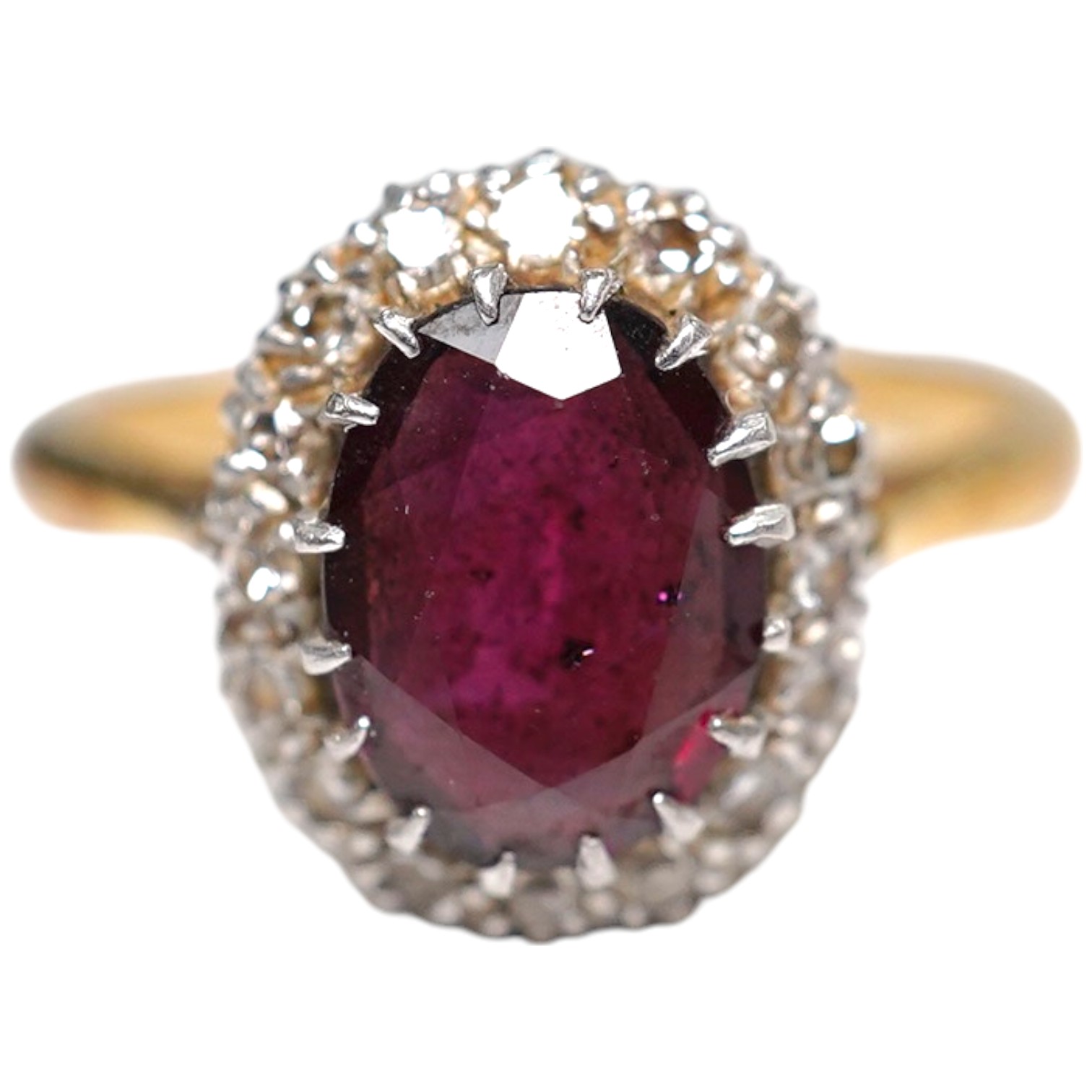 A 9ct and plat, garnet and diamond chip set oval cluster ring, size L, gross weight 3.9 grams. Condition - fair